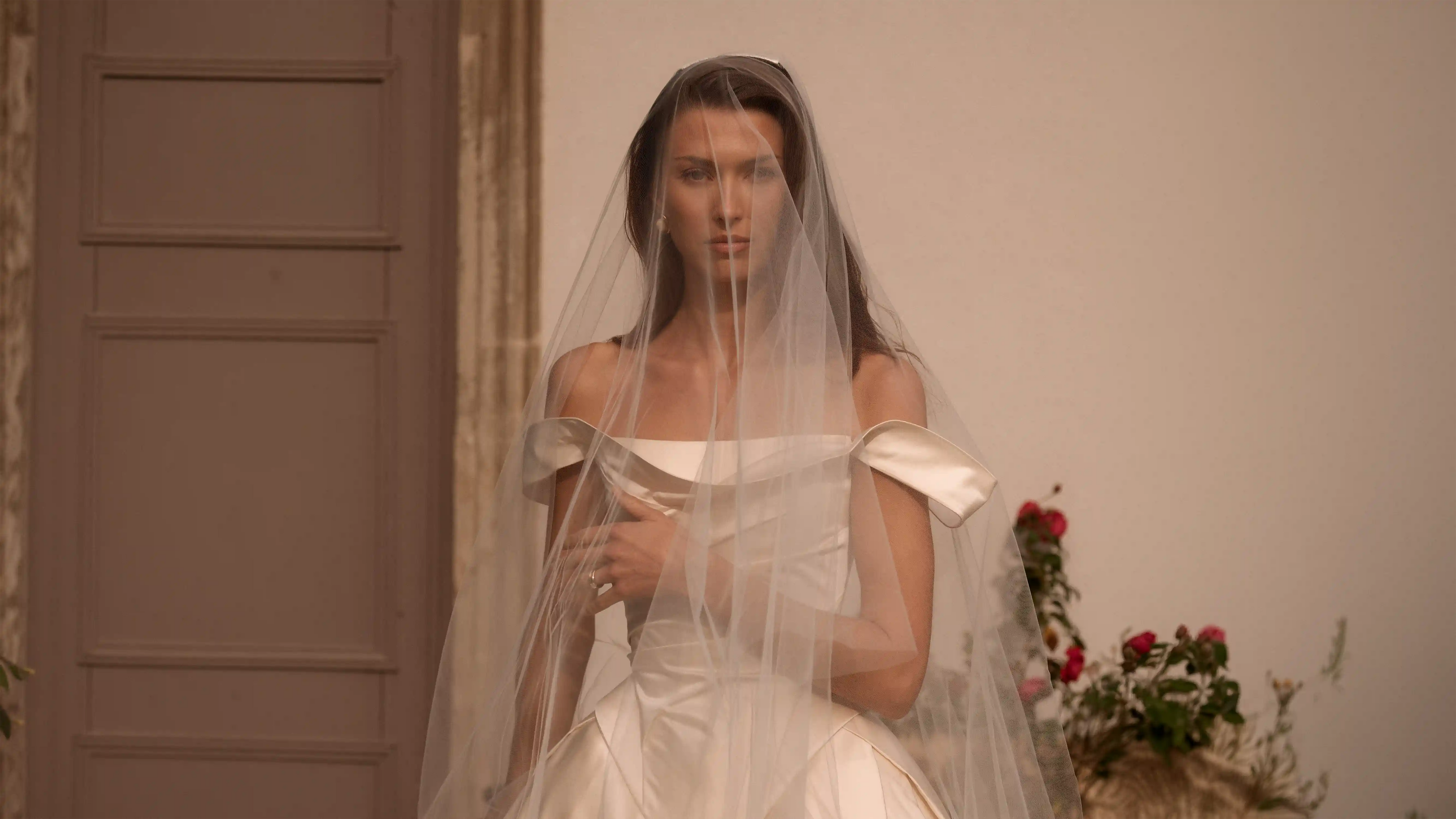 Woman in a wedding dress with a veil.
